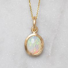 A milky crystal opal has been set into our classic matte gold bezel. Opal measures 10 x 8 mm oval. Weight without chain 2.5g approx. Trace chain measures 45cm. Pictured with a matte finish. For a high shine finish, please leave a note at checkout. Please note, we will match the opal as close to the image as possible. Each opal is unique and may vary in appearance and colour from what is depicted on the site. Opal Necklace Silver, Opal Jewelry Set, Unique Opal, Style Coach, Crystal Opal, Opal Crystal, Opal Necklace, Opal Jewelry, Matte Gold