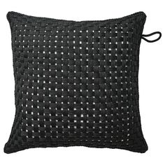 a black pillow with white squares on the front and back, sitting on a white background