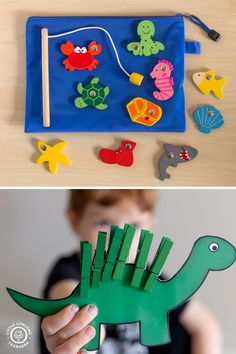 a child is playing with an animal and sea creatures puppet play set in the shape of a dinosaur