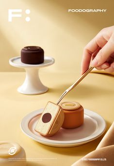 a person holding a spoon over some food on a plate