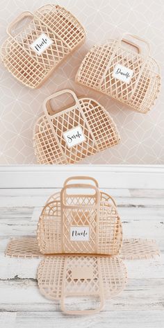 three wicker baskets with name tags on them