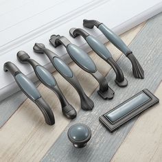 an assortment of door handles and knobs on the floor