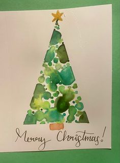 a christmas tree made out of watercolor paper