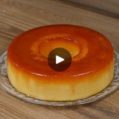 a cake on a glass plate with an orange center