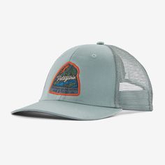 the patagon trucker hat in light blue with an orange patch on the front