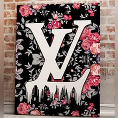 the letter v is painted with flowers and dripping paint