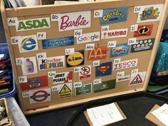 a bulletin board covered in lots of stickers and magnets on it's side