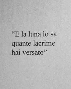 the words are written in black ink on white paper, which reads'e la lunaa lo sa quante lacrime hai versato