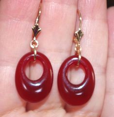 Quality 14K Genuine Red Jade Semi Roud Oval  Hoop Leverback Earrings You are buying a pair r of Vintage Old Stock High Polish Red Jade  hoops stones. These Red Jade  stones measure 20 mm x 15 mm. The whole earrings with leverbacks measures 35 mm. These are gorgeous. 5.6  Grams /  27.5  Carats Comfortable to Wear / Medium Size You will love wearing them. Elegant Small Hoop Red Earrings, Red Hoop Jewelry For Formal Occasions, Red Hoop Pierced Jewelry, Red Small Hoop Jewelry For Anniversary, Red Oval Classic Earrings, Red Pierced Hoop Jewelry, Classic Oval Red Earrings, Classic Red Oval Earrings, Red Hoop Pierced Earrings