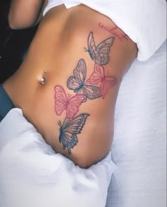 a woman's stomach with butterflies on it