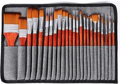 a case filled with lots of orange and white brushes