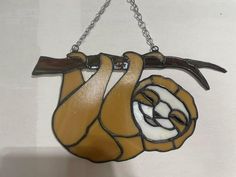 a stained glass slotty hanging from a chain