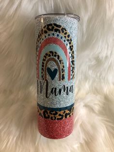 a leopard print tumbler with the word mama on it and a heart in the middle