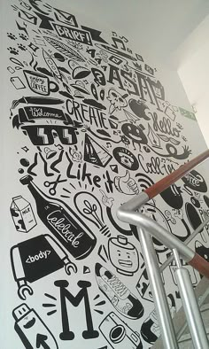 the wall is decorated with black and white doodles