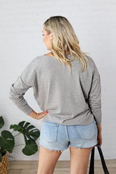 Introducing the Clarice Cozy Sweater, the perfect blend of style and comfort. With a round neck and seam detailing, this sweater is designed for a relaxed fit and features cozy knit fabric for those chilly days. Complete with ribbed hem and cuffs, side slits, and available in Heather Grey, Black, Oatmeal, & Ivory. Pair with jeans or shorts for a versatile look. Round neck Seam detailing on center front Long sleeves, Drop shoulder Cozy Knit Pullover, Relaxed Fit Ribbed hem and cuffs Side slits, H Relaxed Fit Knit V-neck Sweater For Layering, Casual V-neck Sweater For Loungewear In Winter, Casual V-neck Sweater For Winter Loungewear, Casual Knit V-neck Sweater With Ribbed Cuffs, Casual Long Sleeve V-neck Sweater, Cozy Long Sleeve Sweater For Loungewear, Cozy Ribbed V-neck Long Sleeve Sweater, Cozy Soft Knit V-neck Sweater For Layering, Winter Long Sleeve Top With Ribbed Neckline