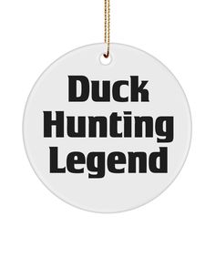 a white ornament with black lettering that says duck hunting legend on the front