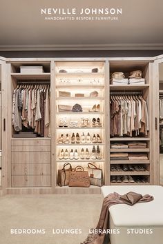 an open closet with clothes and handbags on the shelves in front of it is shown