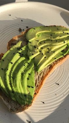 a piece of bread with avocado on it