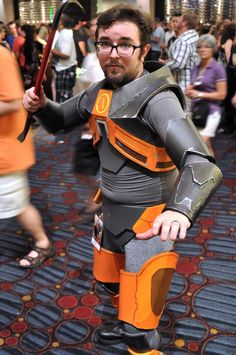 a man dressed up in an orange and gray costume