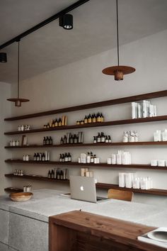 the shelves are filled with bottles and jars