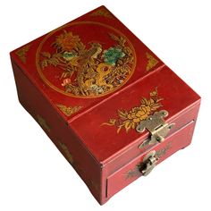 an ornate red box with gold designs on it