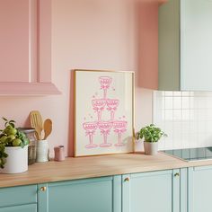 a kitchen with pink walls and wooden counter tops, potted plants on the counters