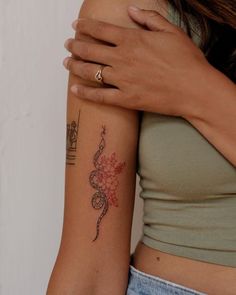 a woman with a tattoo on her arm