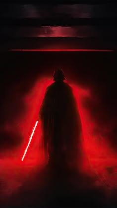 darth vader standing in the dark with red light coming from his chest and lights behind him