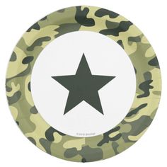 a green and white plate with a black star on the center, in camouflage print