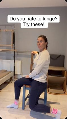 a woman sitting on top of a wooden chair