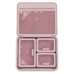 an open pink lunch box with four compartments