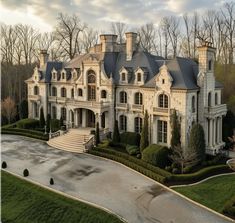 an aerial view of a large white mansion