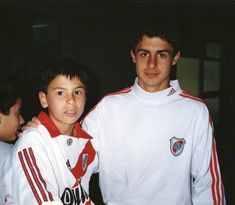 two young men standing next to each other