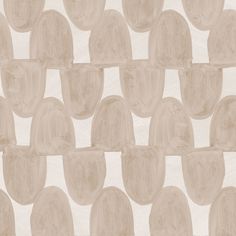 a white and beige wallpaper with circles on it