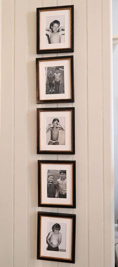 four black and white photos hanging on the wall