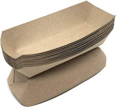 a stack of brown paper plates sitting on top of each other