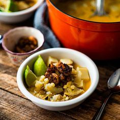 two bowls of food on a wooden table