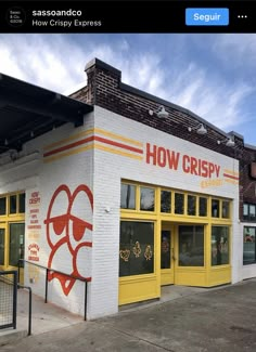 a restaurant with yellow doors and red lettering on the side of it's building