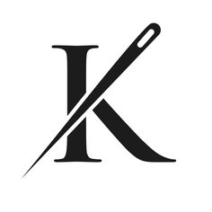 the letter k is cut in half with a pair of scissors on top of it