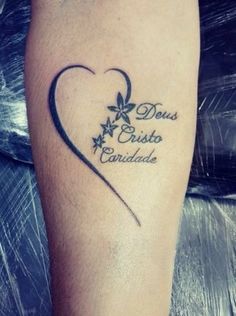 a tattoo on the leg of a person with a heart and stars in it that says,