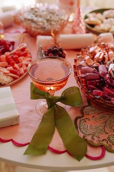 a table topped with lots of different types of food and drinks on top of it