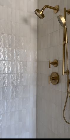 the shower head and handset are gold in color