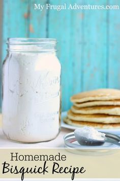 homemade biscuit recipe in a mason jar on a table with pancakes and spoons