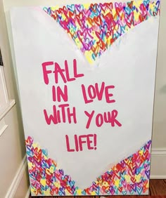 a sign that says fall in love with your life