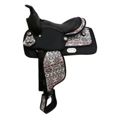 a black and white horse saddle with a colorful pattern on the seat, in front of a