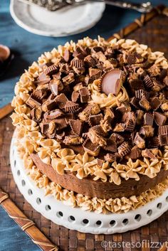 a cake with chocolate and peanut butter on top