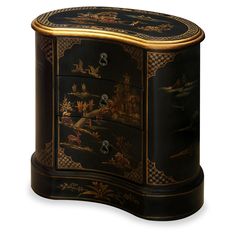 a black and gold decorated chest with drawers