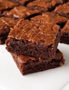 chocolate brownies stacked on top of each other