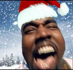 a man in a santa hat making a funny face with his mouth open and tongue out