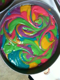 there is a colorful cake in the pan